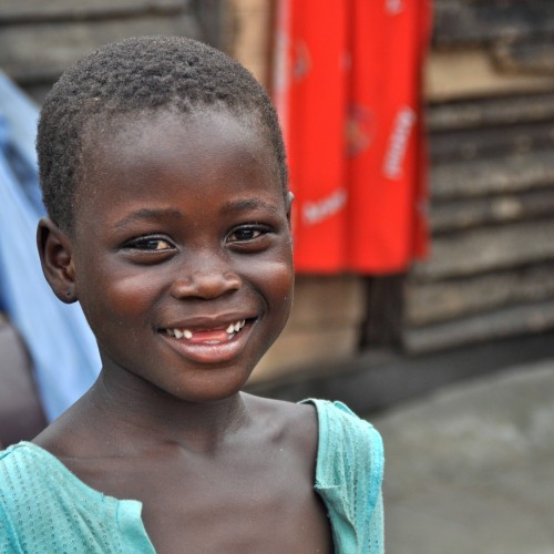 Girl staring at camera smiling.